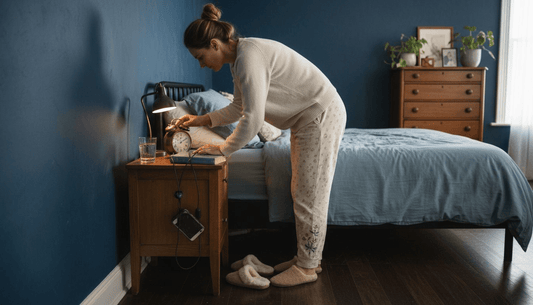 Woman preparing bedroom for restful sleep