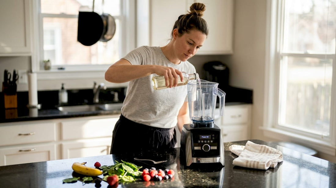 Woman pouring MCT oil into blender