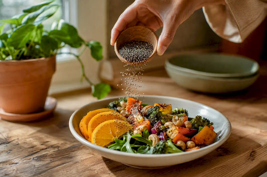 Hands adding calcium seeds to meal plate