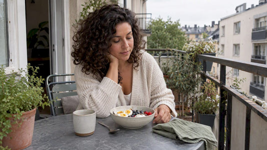 Woman pausing mindfully before protein breakfast