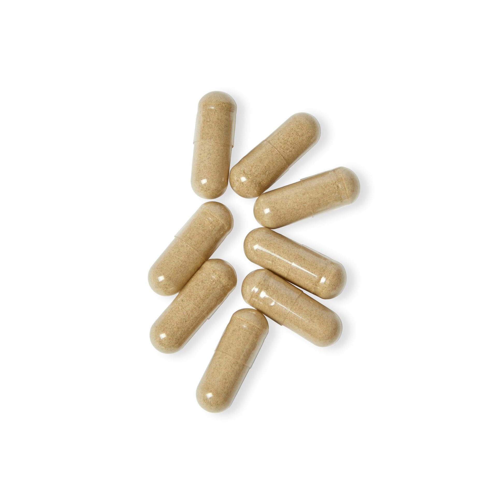 Nutribliss Beige capsules scattered on a white background
